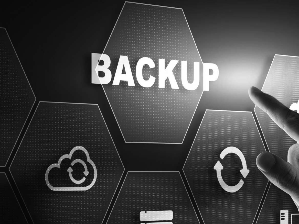 A hand points toward a glowing hexagon labeled BACKUP on a digital interface, surrounded by icons representing cloud storage, data synchronization, and files—perfect for illustrating a reliable backup or data recovery guide.